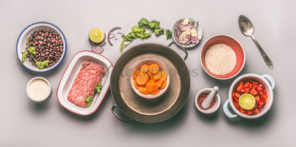 Similar – Image, Stock Photo Ingredients for rice beans stew with minced meat