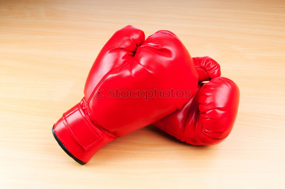 Similar – Image, Stock Photo hand is wearing a red leather boxing glove on a green background