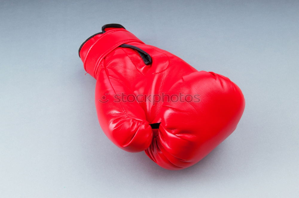 Similar – Image, Stock Photo red leather boxing gloves, a plastic water bottle