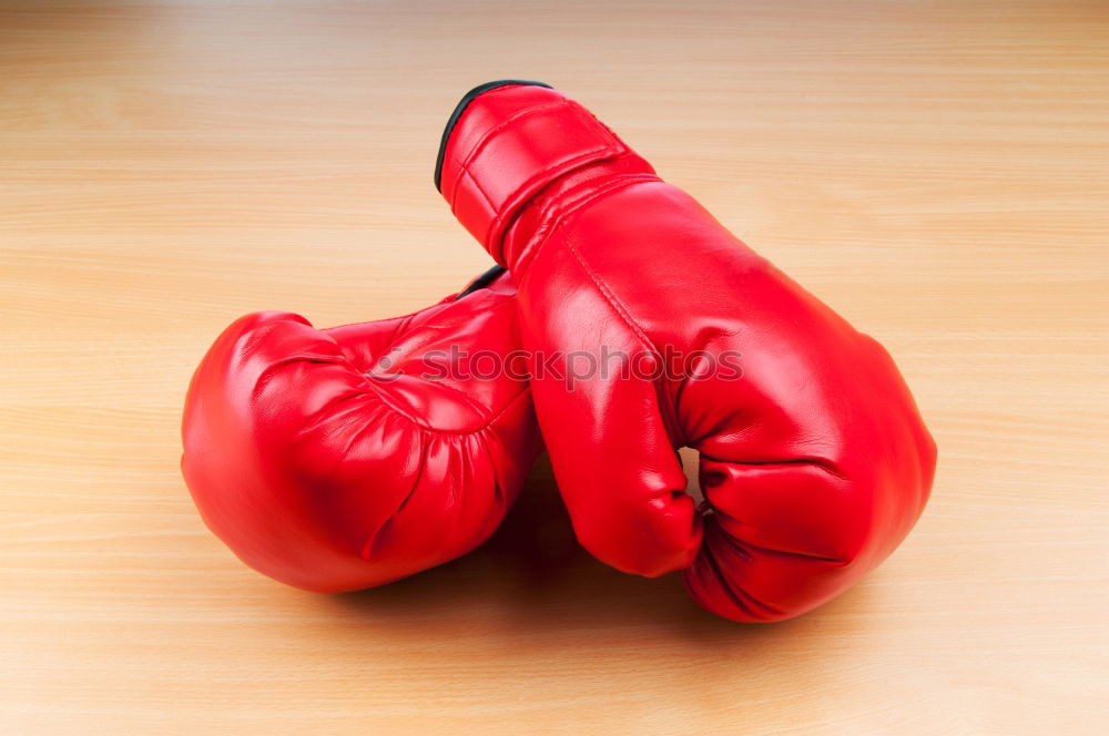 Similar – Image, Stock Photo hand is wearing a red leather boxing glove on a green background