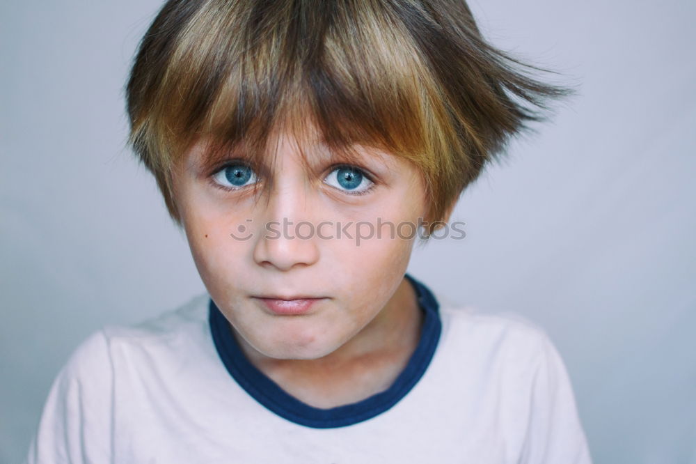 Similar – cute sad child boy portrait