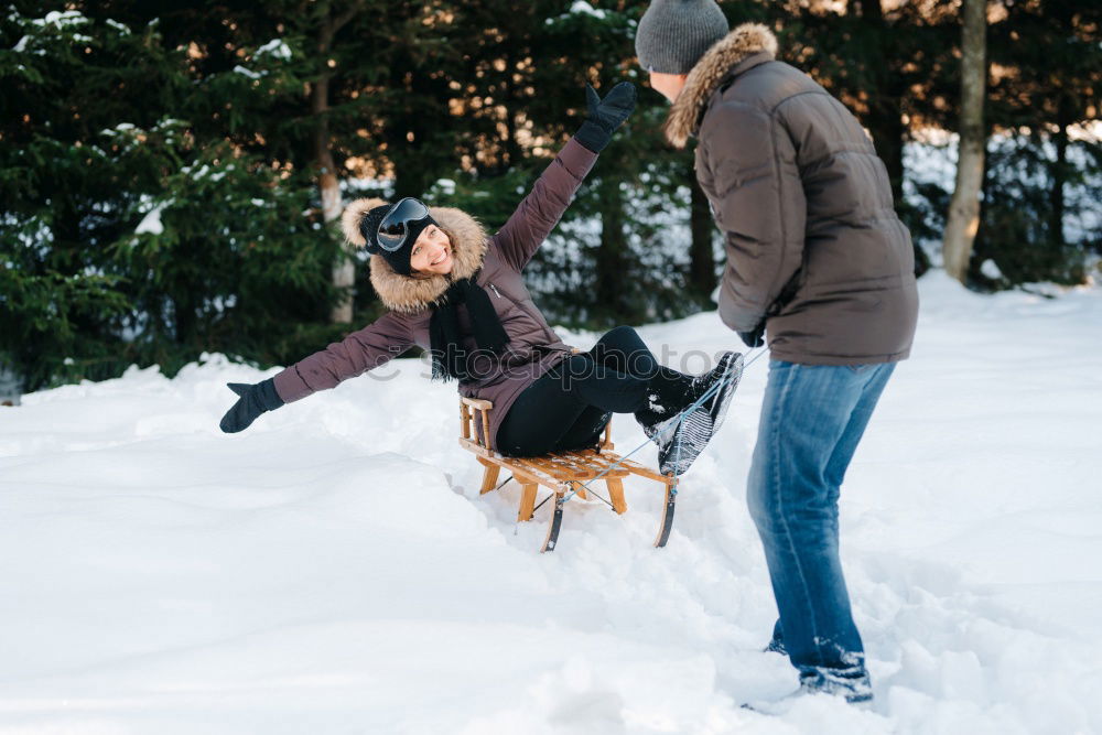 Similar – Couple having fun in winter forest