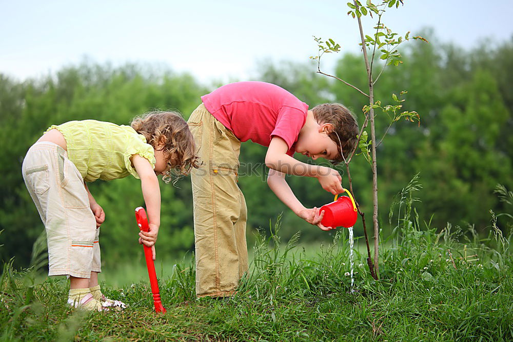 Similar – Image, Stock Photo Boy and girl picking up garbage from ground