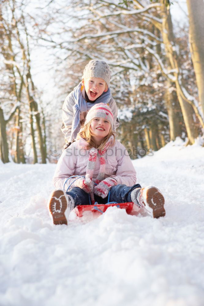 Similar – Mother is playing with her little daughter outdoors in winter