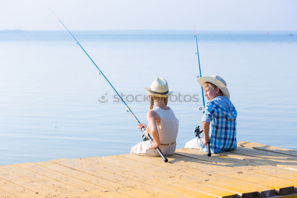 Similar – Image, Stock Photo Little boy on a dock sitting on his back looking to the ocean