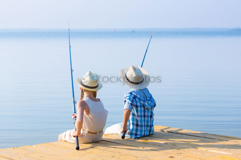 Similar – Image, Stock Photo Little boy on a dock sitting on his back looking to the ocean