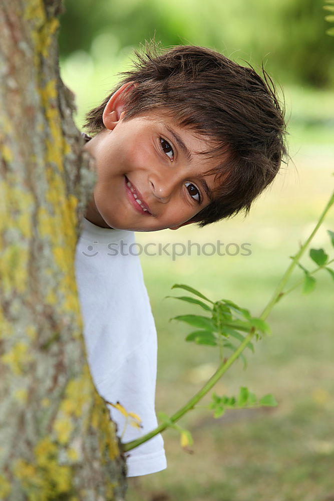 Similar – Cute child in the woods playing alone