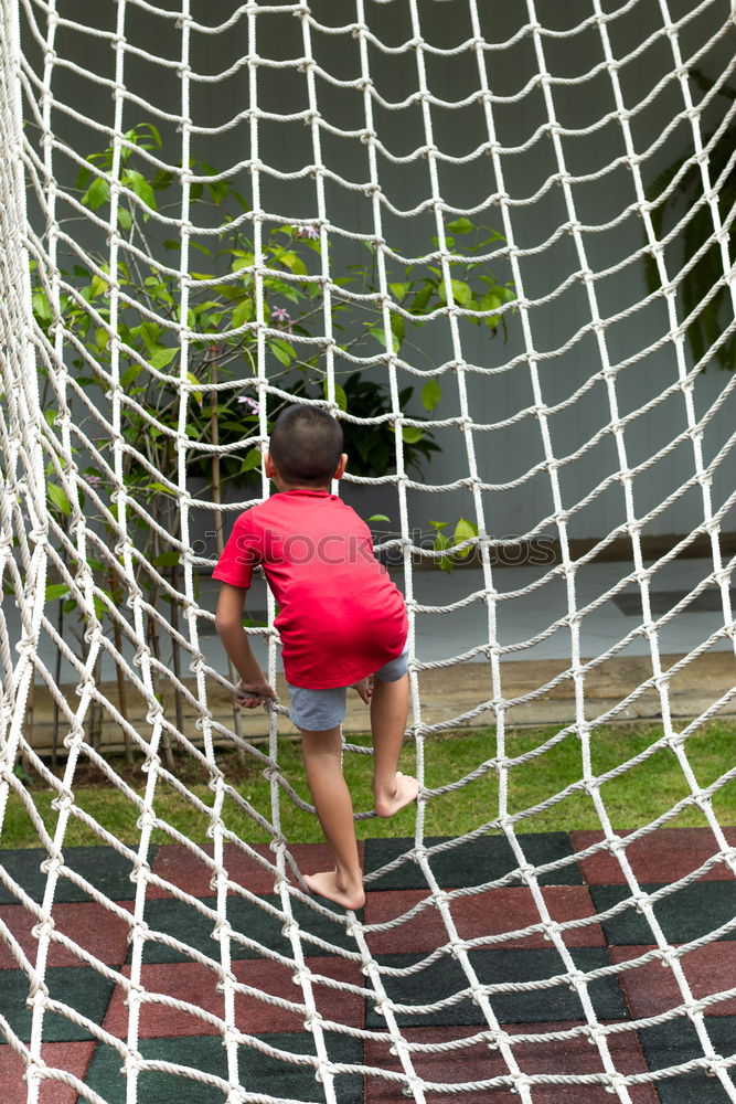 Similar – Child climbing on a playground