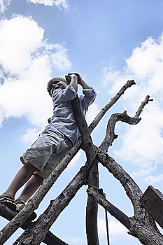 Similar – Woman with afro hair climbing by children’s attractions.