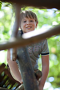 Similar – Cute child in the woods playing alone