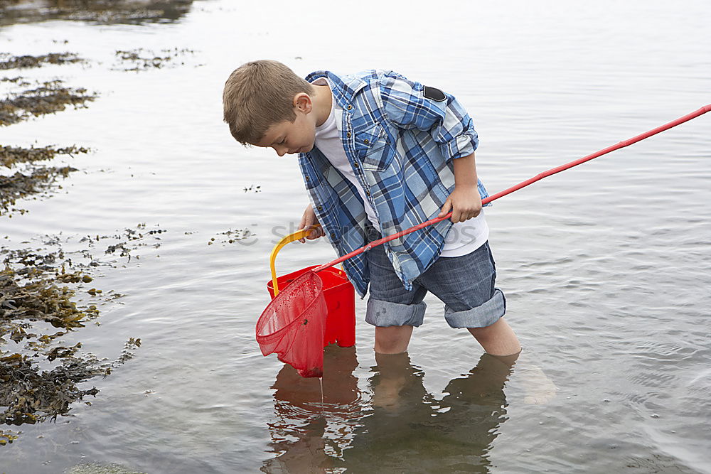 Similar – Image, Stock Photo little boy points to the path where he has discovered something