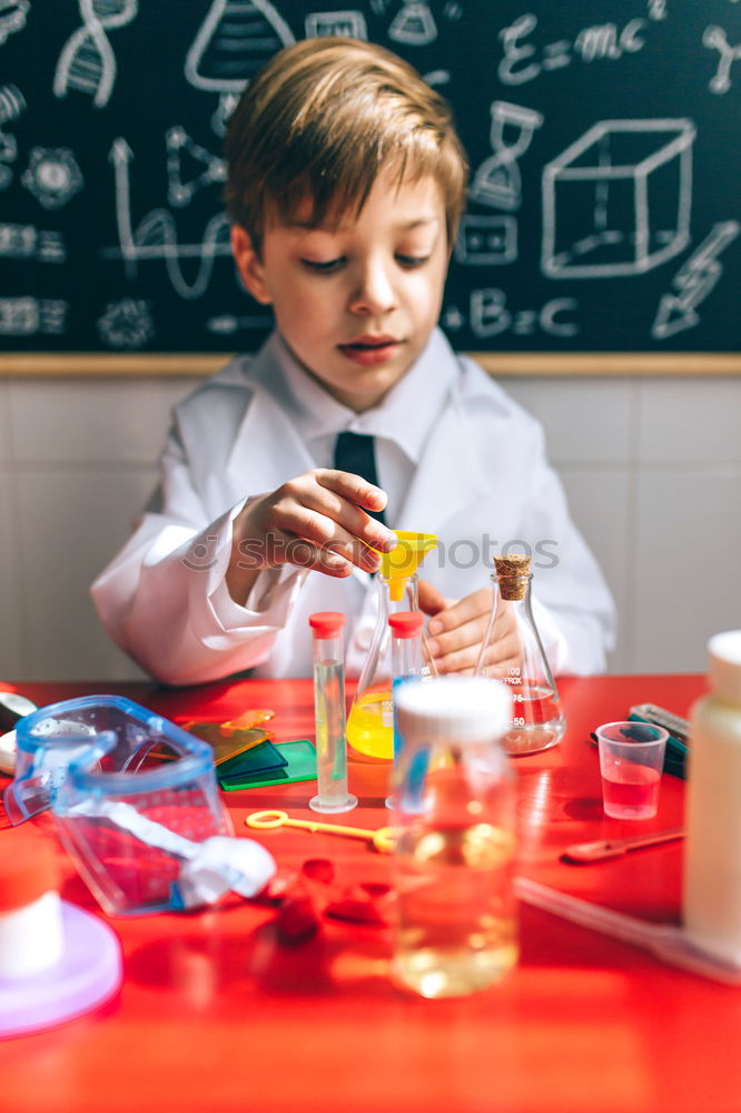 Image, Stock Photo Boy playing with chemistry game