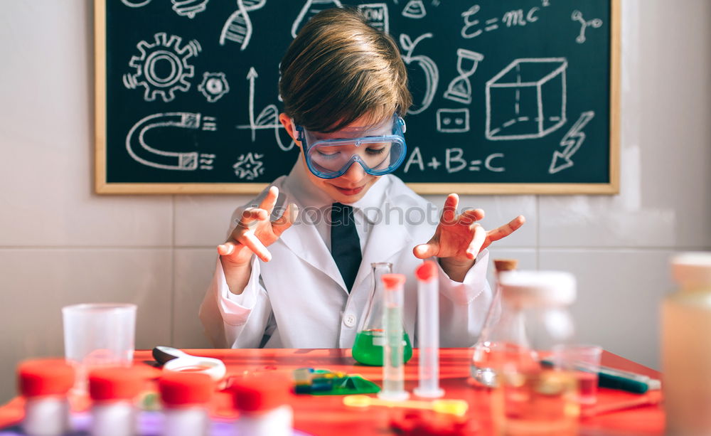 Image, Stock Photo Boy playing with chemistry game