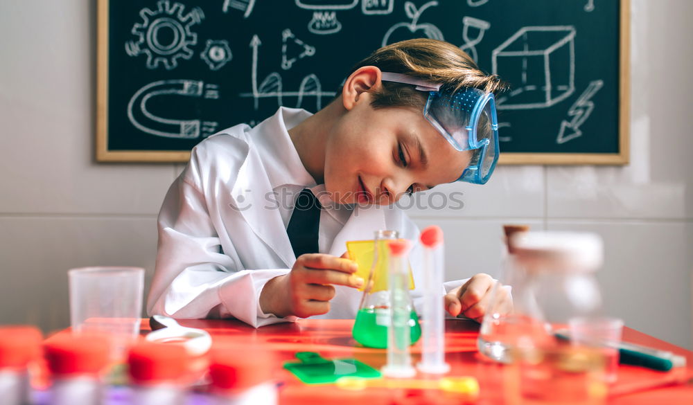 Similar – Image, Stock Photo Boy playing with chemistry game