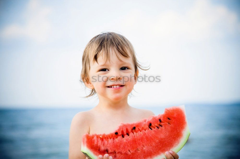 Similar – Image, Stock Photo Woman eating watermelon at the beach in sunset