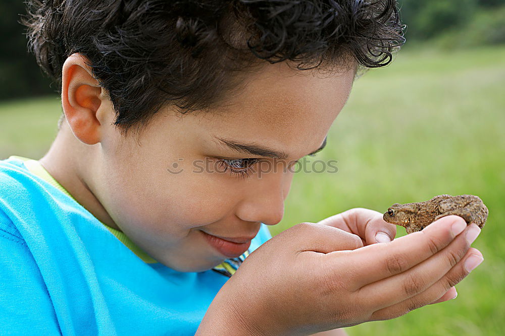 Similar – Image, Stock Photo little boy points to the path where he has discovered something