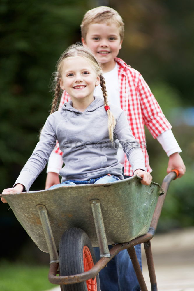 Similar – Image, Stock Photo Young boy pushing little sister in a baby stroller