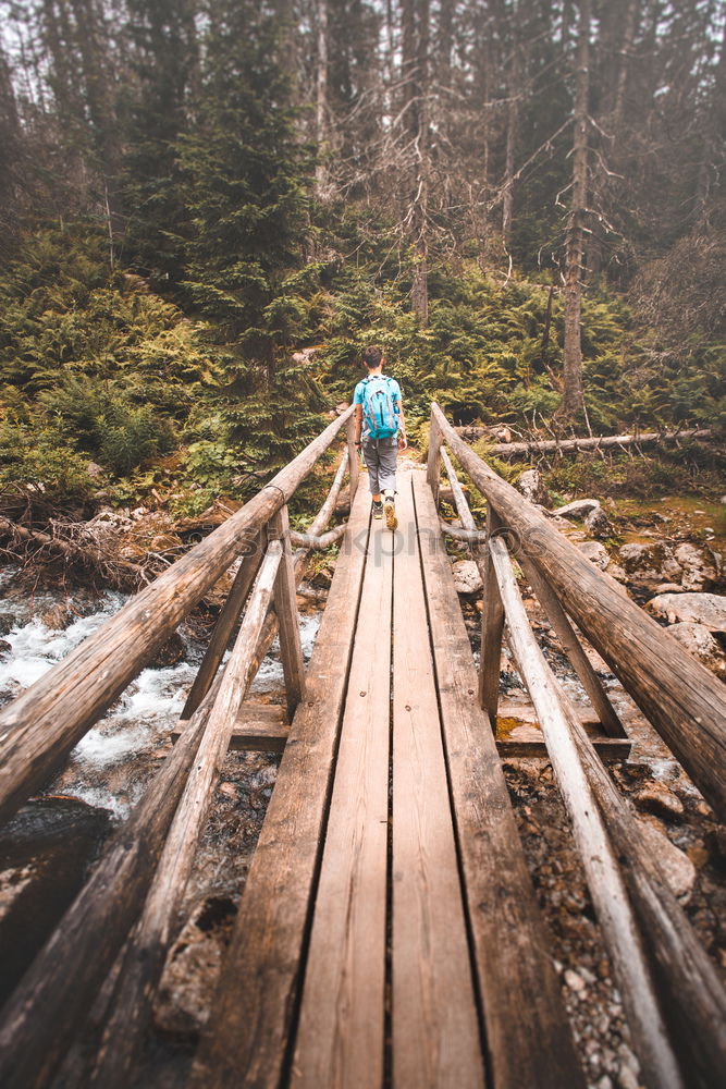 Similar – 2 people hiking show their hiking boots