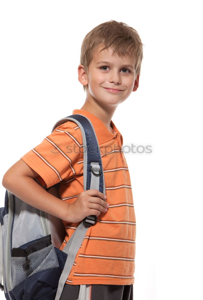 Similar – Cheerful child standing with his backpack on the floor