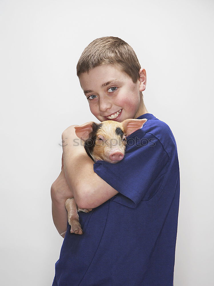 Similar – Little boy sitting with farm chickens