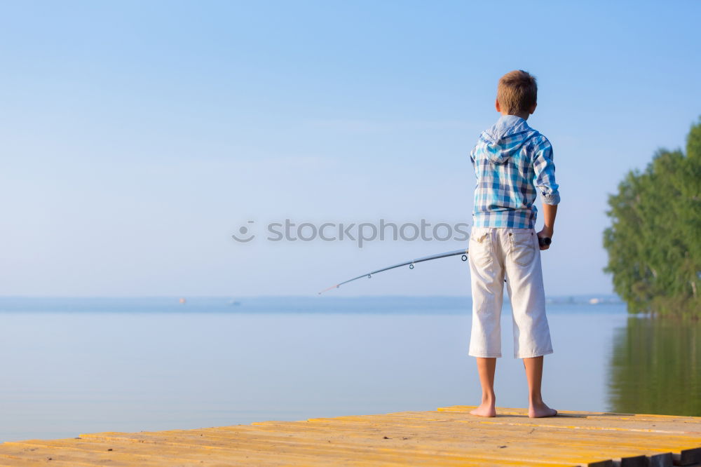 Similar – Image, Stock Photo Man on fishing with rod