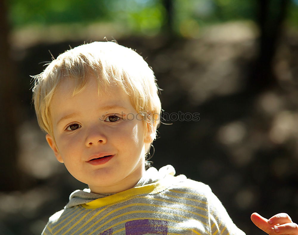 Similar – Toddler sitting in a tree