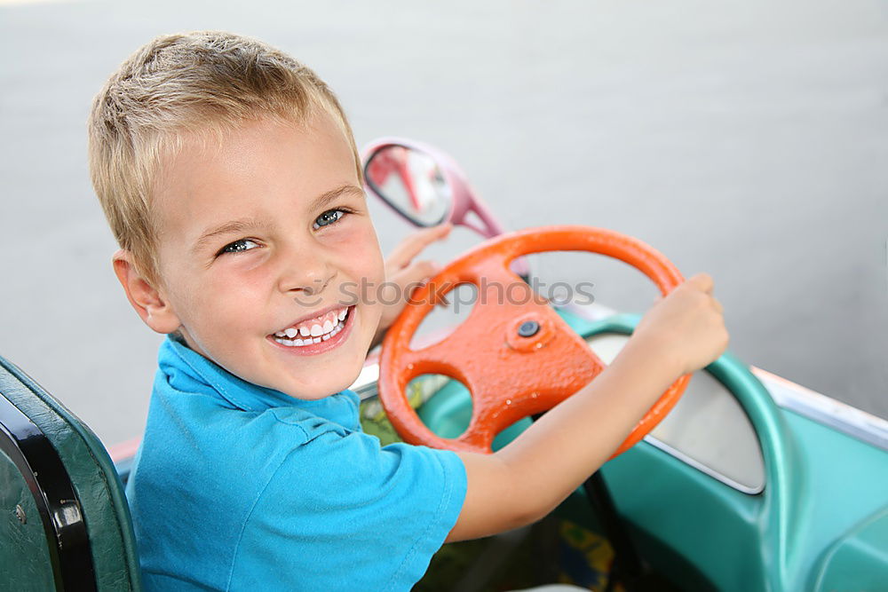Similar – Image, Stock Photo One little boy sitting in the car and look out from the car window at the day time. Concept of happy trip.