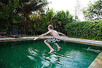 Similar – junge Frau im Pool hält ein Glas Weißwein in die Höhe während ihr das Wasser bis zum Hals steht