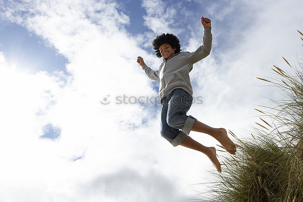 Similar – Low view of a happy redhead woman outdoors