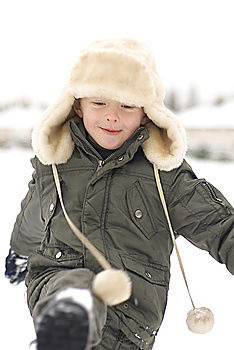 Similar – Child playing on the snow