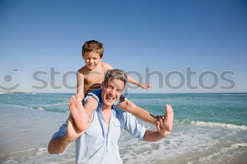 Similar – Image, Stock Photo Father and son playing on the beach at the day time.