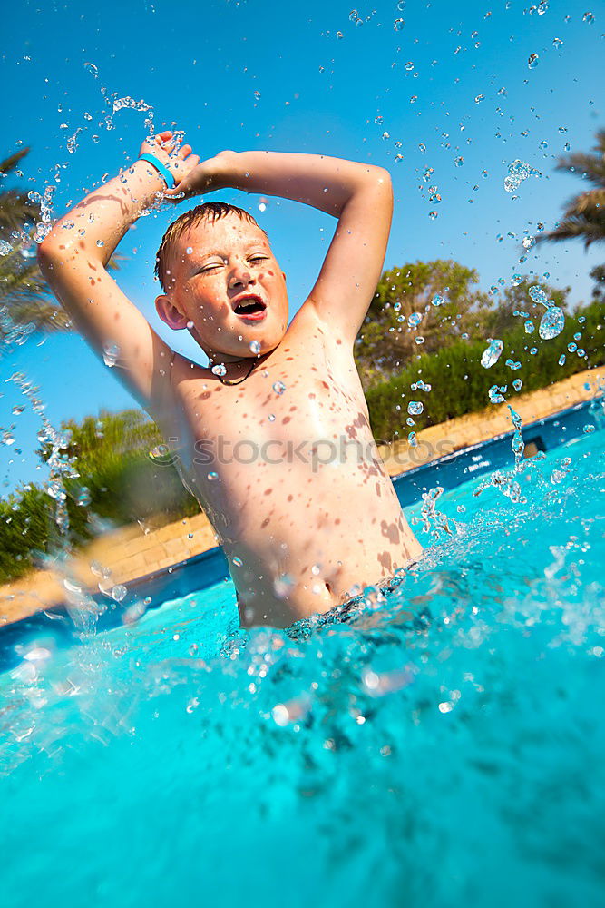 Similar – Image, Stock Photo Happy little girl floating with a ring in the water