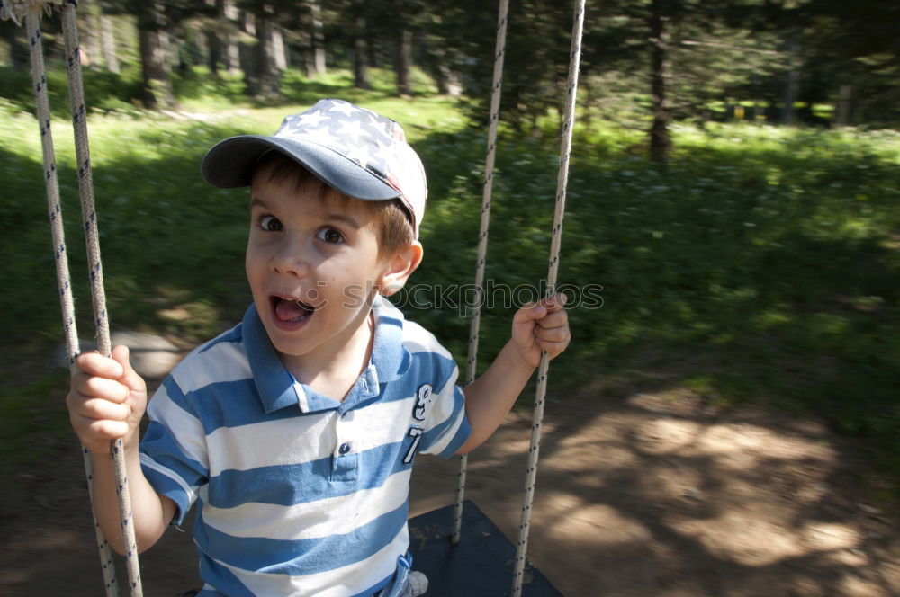 Similar – Toddler sitting in a tree