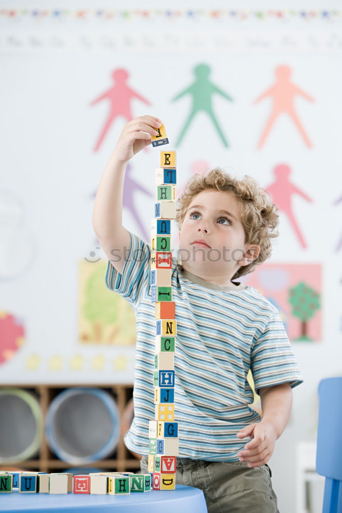 Similar – Image, Stock Photo Happy baby playing with toy blocks.