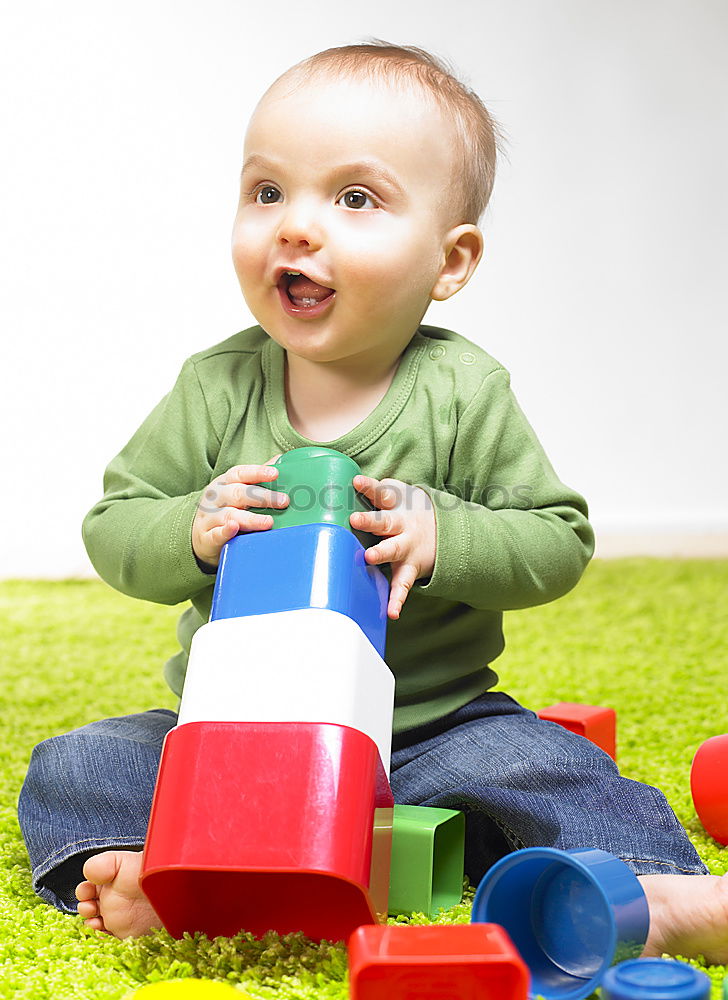 Similar – Image, Stock Photo Happy baby playing with toy blocks.