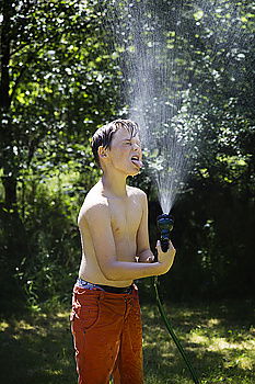 Similar – Sprinkler Fun Summer Water