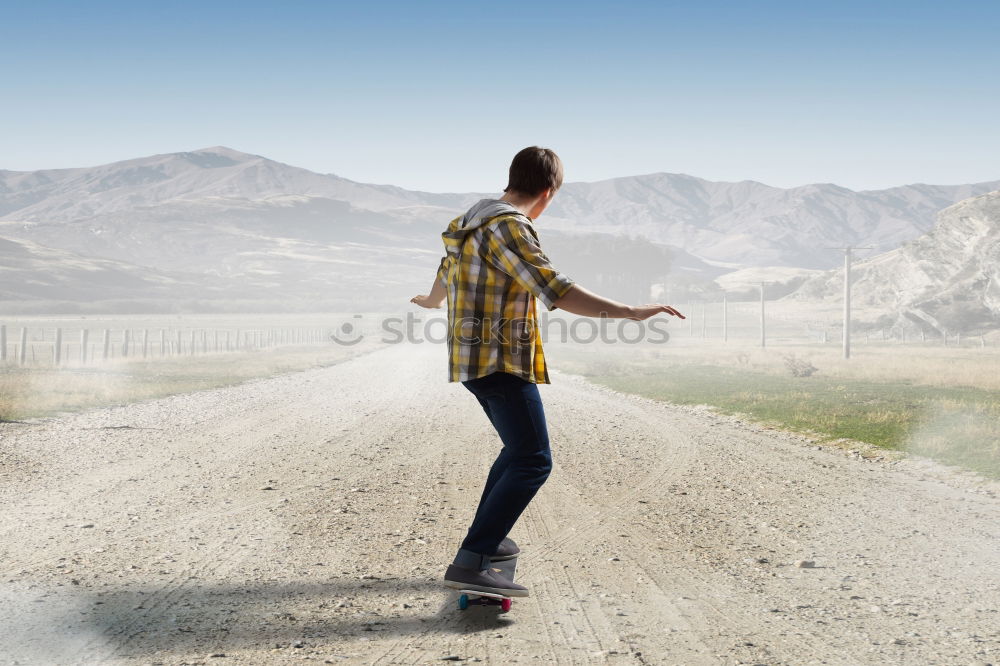 Similar – Image, Stock Photo Happy little boy playing on the road at the day time. Kid having fun outdoors. He skateboarding on the road. Concept of sport.