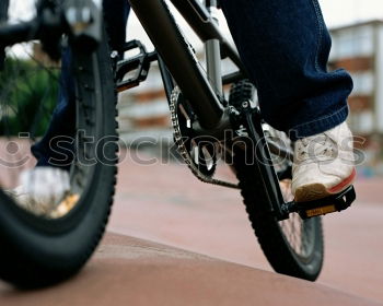 Similar – Image, Stock Photo the gloved man’s hand grabbed the bicycle after the repair at the frame and turned it around with power and momentum