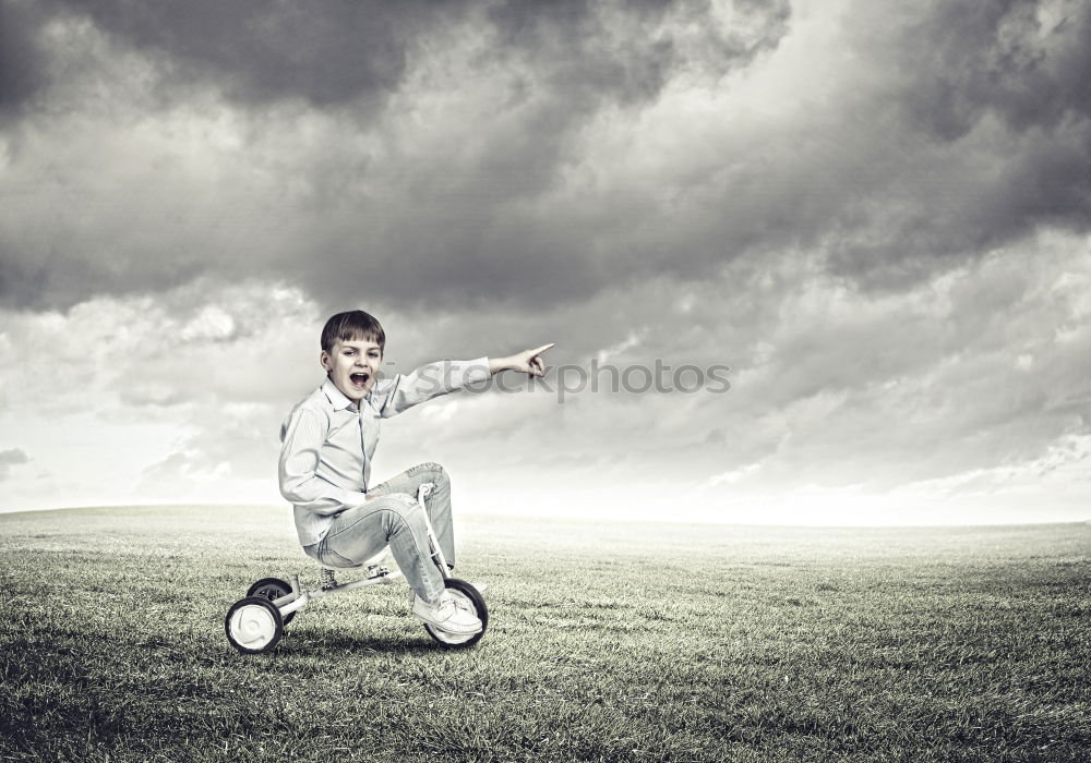 Similar – Young little boy playing in the field with soccer ball. Concept of sport.