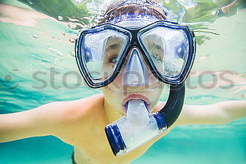 Similar – Kid in snorkel mask posing on poolside