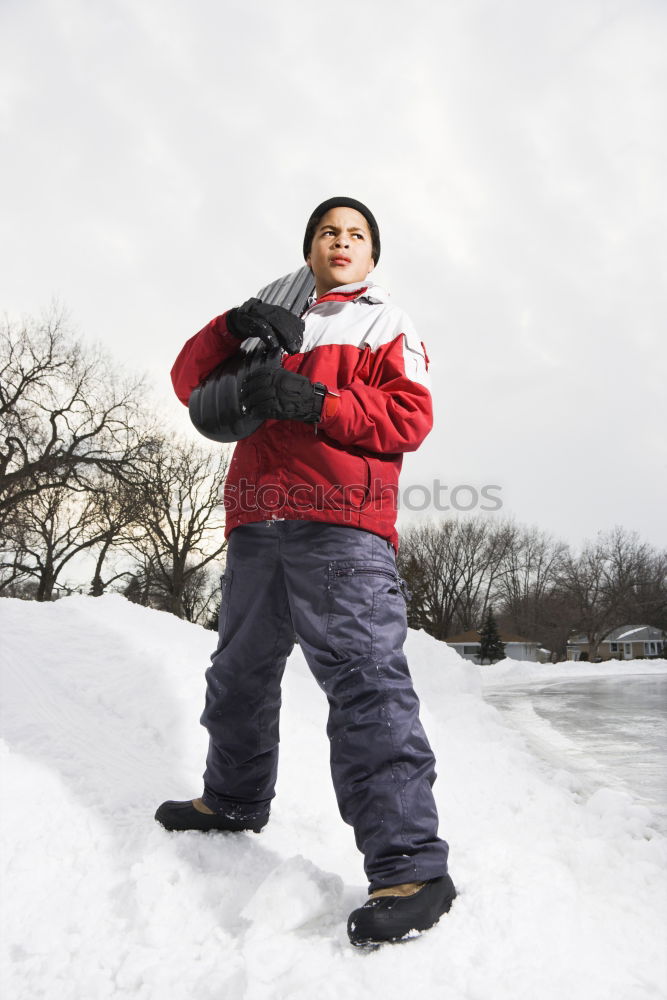 Similar – Child playing on the snow