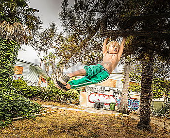 Similar – Image, Stock Photo Young sportsman performing his acrobatic skills in doing somersault. Show in the city street