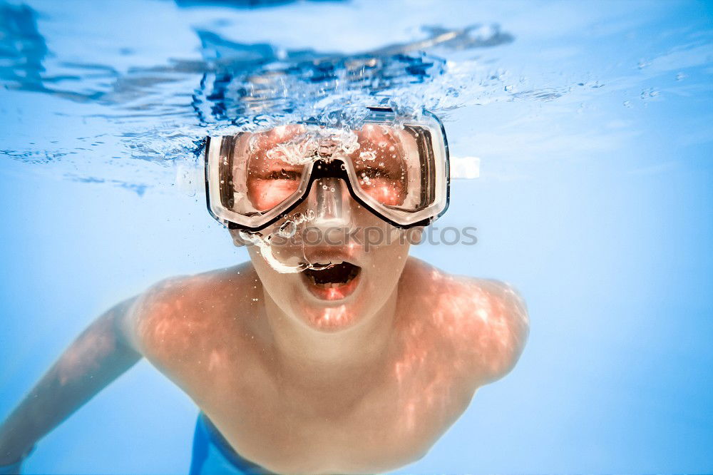 Similar – Kid in snorkel mask posing on poolside