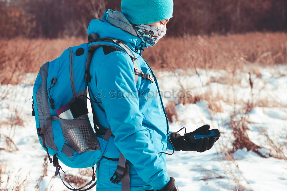 Image, Stock Photo Boy using the mobile phone during the winter trip