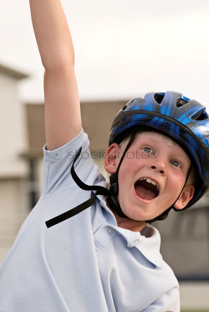 Similar – Cool gap | Portrait of a boy with a bicycle helmet and a tooth gap