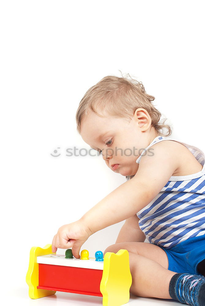 Similar – Young boy talking to the phone in a yellow telephone booth