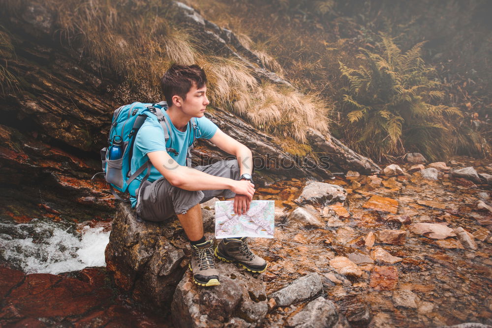 Similar – Image, Stock Photo Boy packing his clothes to backpack on trail