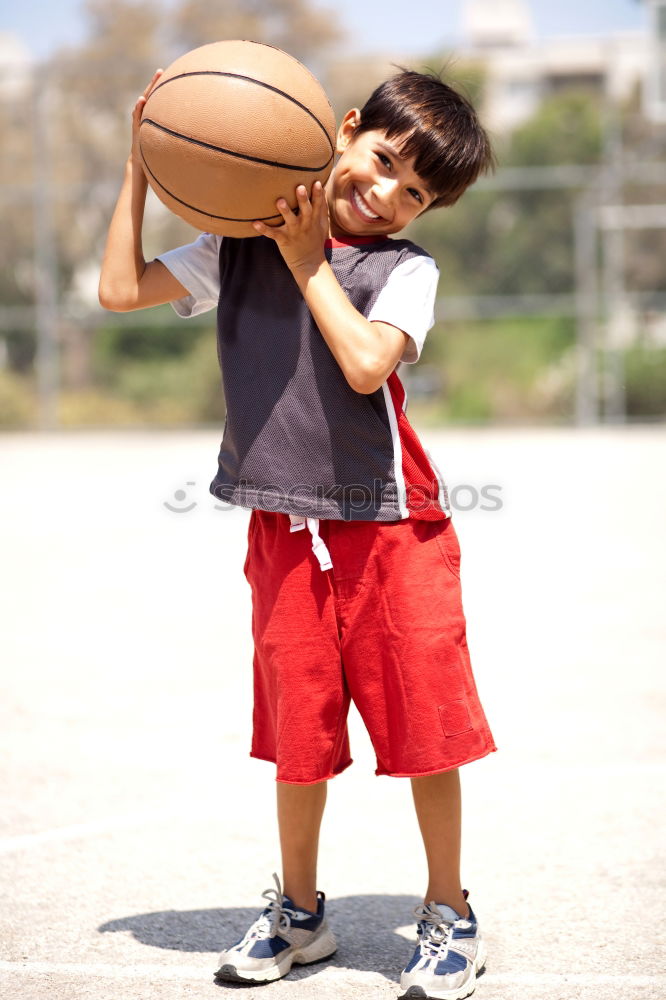 Similar – Teenage playing basketball on an outdoors court