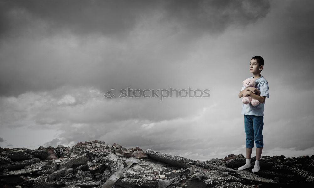 Similar – Woman posing on ground near dry trees