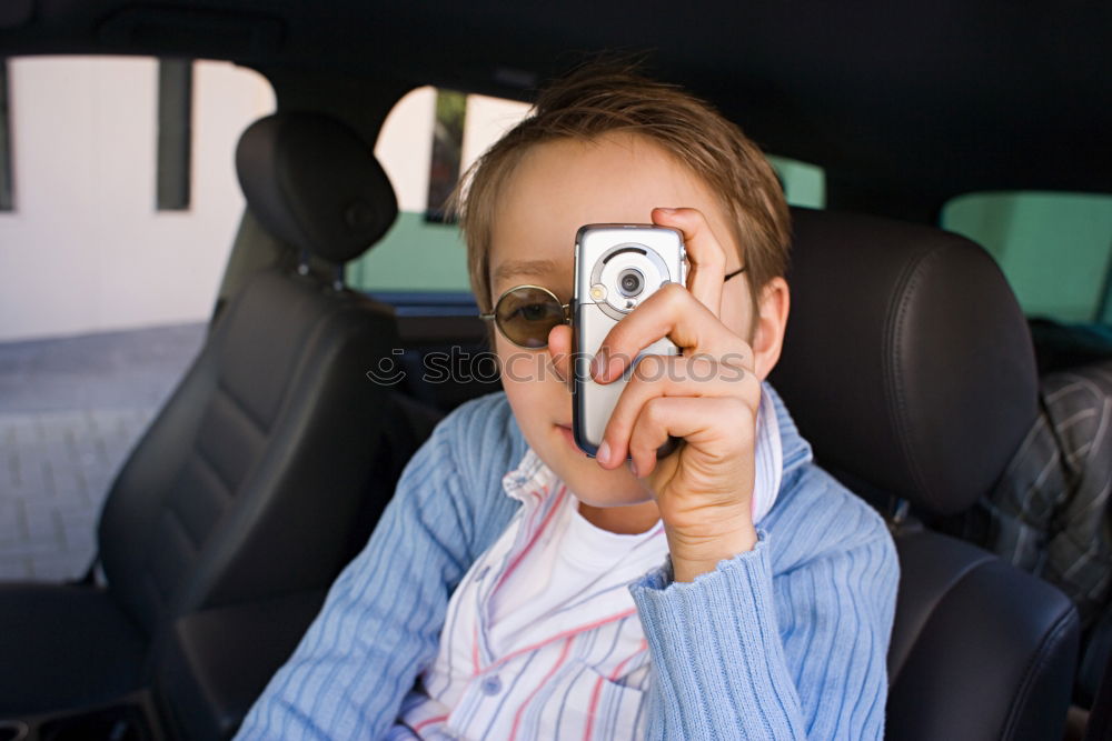 Similar – Image, Stock Photo funny child girl playing driver, sitting on front seat in car